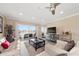 Living room with water views, comfortable seating, and a large TV at 400 Larboard Way # 106, Clearwater Beach, FL 33767