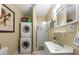 Convenient laundry room with stackable washer and dryer at 400 Larboard Way # 106, Clearwater Beach, FL 33767