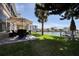 Relaxing patio area with outdoor furniture, offering waterfront views at 400 Larboard Way # 106, Clearwater Beach, FL 33767