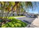 Covered parking with ample space and landscaping at 400 Larboard Way # 106, Clearwater Beach, FL 33767
