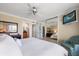 Main bedroom with mirrored closet and ensuite bathroom at 400 Larboard Way # 106, Clearwater Beach, FL 33767