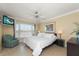 Bright bedroom with king-size bed and water views at 400 Larboard Way # 106, Clearwater Beach, FL 33767