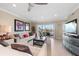 Spacious living room with water views and comfortable seating at 400 Larboard Way # 106, Clearwater Beach, FL 33767