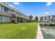 Waterfront property with lush lawn and canal views at 400 Larboard Way # 106, Clearwater Beach, FL 33767