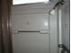 Shower stall with a small palm tree decal at 231 Tarpon Ln, Oldsmar, FL 34677