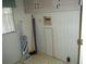 Small laundry area with storage cabinets at 231 Tarpon Ln, Oldsmar, FL 34677