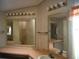 Double vanity with a large mirror and updated lighting at 231 Tarpon Ln, Oldsmar, FL 34677