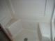 Corner shower with built-in seat at 231 Tarpon Ln, Oldsmar, FL 34677