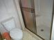 Bathroom with toilet and shower stall at 231 Tarpon Ln, Oldsmar, FL 34677