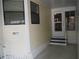 Side exterior view with entrance at 231 Tarpon Ln, Oldsmar, FL 34677