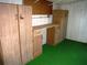 Workshop with cabinets and a work bench at 231 Tarpon Ln, Oldsmar, FL 34677