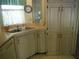 Bright kitchen features ample cabinetry and a double sink at 231 Tarpon Ln, Oldsmar, FL 34677