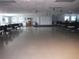Spacious community room with tables and chairs at 231 Tarpon Ln, Oldsmar, FL 34677