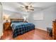 Spacious bedroom with wood flooring and large bed at 3713 Luma Dr, Holiday, FL 34691