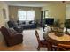 Spacious living area with a dining table and comfortable seating at 2587 Countryside Blvd # 6204, Clearwater, FL 33761