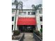 Building exterior with red awning and entrance at 2587 Countryside Blvd # 6204, Clearwater, FL 33761