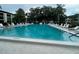 Inviting swimming pool with plenty of lounge chairs at 2587 Countryside Blvd # 6204, Clearwater, FL 33761