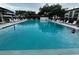 Refreshing community pool with ample lounge chairs at 2587 Countryside Blvd # 6306, Clearwater, FL 33761