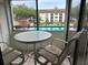 Balcony with table and chairs overlooking a community pool at 2587 Countryside Blvd # 6306, Clearwater, FL 33761