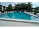 Large, refreshing community pool with plenty of lounge chairs at 2587 Countryside Blvd # 6306, Clearwater, FL 33761