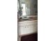 Bathroom with single sink vanity and linen cabinet at 2587 Countryside Blvd # 6306, Clearwater, FL 33761