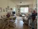 Bright living room and dining area with laminate flooring at 2587 Countryside Blvd # 6306, Clearwater, FL 33761