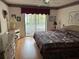 Spacious bedroom with king-size bed and access to balcony at 2587 Countryside Blvd # 6306, Clearwater, FL 33761