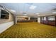 Multi-purpose room with large screen and tables at 1346 Hickory Moss Pl, Trinity, FL 34655