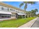 Exterior view of a two-story building with balconies at 4001 58Th N St # 16, Kenneth City, FL 33709