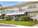 Attractive condo building with well-manicured landscaping at 4001 58Th N St # 16, Kenneth City, FL 33709