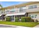 Attractive condo building with well-manicured landscaping at 4001 58Th N St # 16, Kenneth City, FL 33709