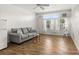 Bright living room with hardwood floors and window at 4001 58Th N St # 16, Kenneth City, FL 33709