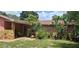 Charming single story home with stone accents and lush landscaping at 8665 Mockingbird Ln, Seminole, FL 33777