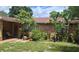 Charming single story home with stone accents and lush landscaping at 8665 Mockingbird Ln, Seminole, FL 33777