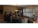 Bright dining room featuring large windows and a spacious dining table at 8665 Mockingbird Ln, Seminole, FL 33777