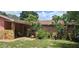 Beautiful house exterior with stone accents and landscaping at 8665 Mockingbird Ln, Seminole, FL 33777