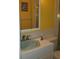 Bright bathroom with single sink vanity and shower/tub combo at 8665 Mockingbird Ln, Seminole, FL 33777