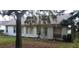 Back of house showing windows, door, and backyard at 4714 Cavendish Dr, New Port Richey, FL 34655