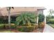 Landscaped entryway with lush tropical plants and walkway at 4714 Cavendish Dr, New Port Richey, FL 34655