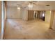 Large living room with open floor plan and chandelier at 4714 Cavendish Dr, New Port Richey, FL 34655