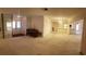 Open concept living area with access to kitchen at 4714 Cavendish Dr, New Port Richey, FL 34655
