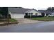 House exterior view, with driveway and street visible at 4714 Cavendish Dr, New Port Richey, FL 34655