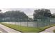 Tennis court with chain link fence at 4714 Cavendish Dr, New Port Richey, FL 34655