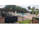 Community pool with covered patio and grills at 4714 Cavendish Dr, New Port Richey, FL 34655