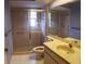 Bathroom with walk-in shower and vanity at 4714 Cavendish Dr, New Port Richey, FL 34655