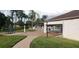 Community pool with patio furniture and brick pavers at 4714 Cavendish Dr, New Port Richey, FL 34655