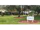 Heritage Lake clubhouse with landscaping and flag display at 4714 Cavendish Dr, New Port Richey, FL 34655