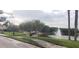 Lakefront walkway with fountain and landscaping at 4714 Cavendish Dr, New Port Richey, FL 34655