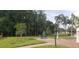 Picnic table with umbrella near the lake at 4714 Cavendish Dr, New Port Richey, FL 34655