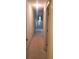 Long hallway with carpet and neutral walls at 4714 Cavendish Dr, New Port Richey, FL 34655